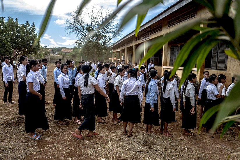 Students line up for class at Students walk to class at Borkeo Lower secondary school -Laminh commune - Borkeo district, Ratanakiri Province Cambodia. The school offers a boarding facility for children who's families live in rural communities making acces