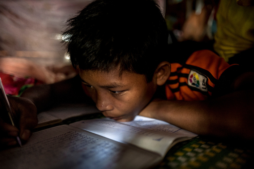 Student studies at Borkeo Lower secondary school -Laminh commune - Borkeo district, Ratanakiri Province Cambodia. The school offers a boarding facility for children who's families live in rural communities making access to school difficult.