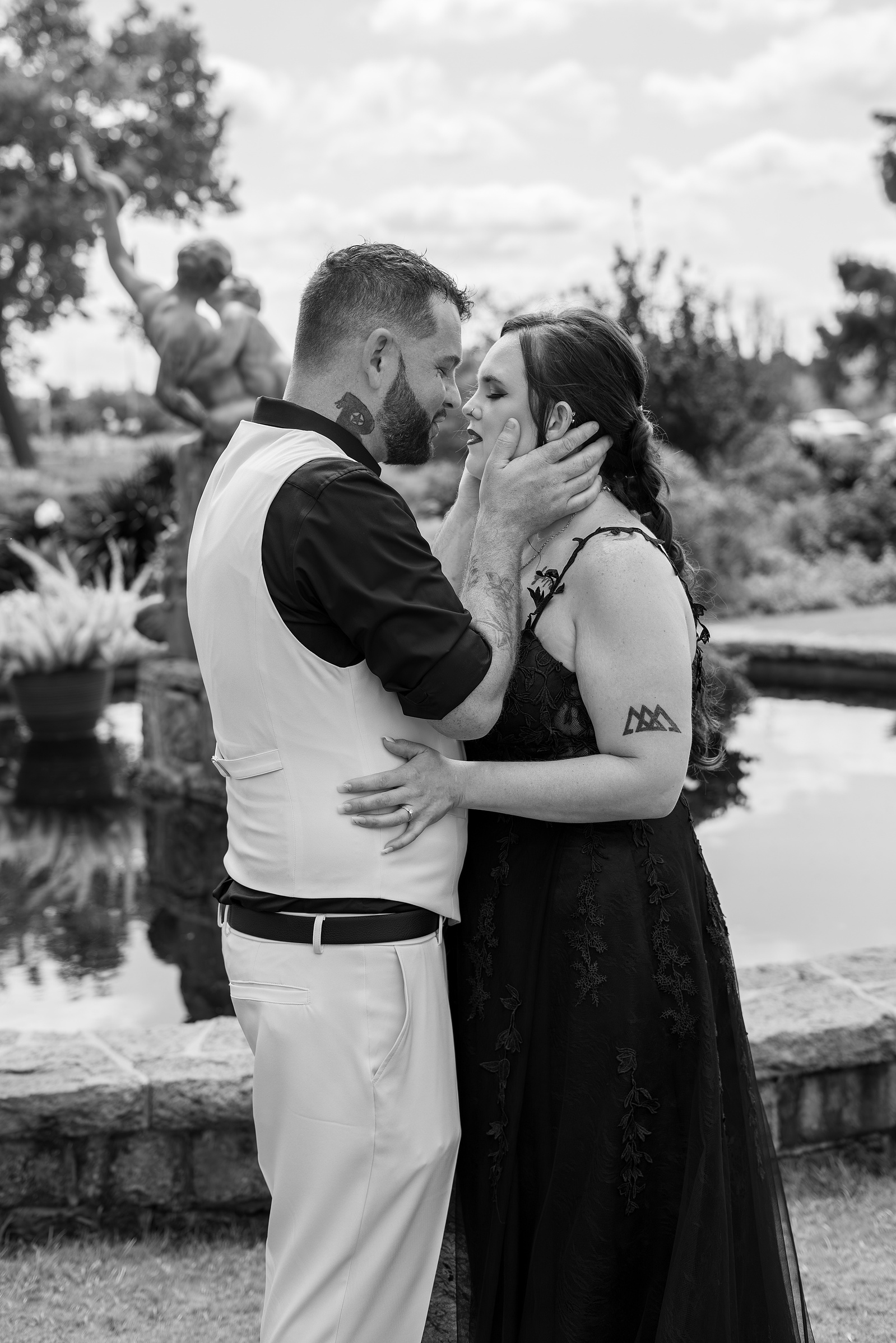 A black-and-white wedding portrait of a newlywed couple by Flame Frame Photography in Oklahoma City
