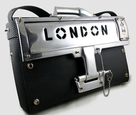 Hi Tek leather briefcase with shoulder strap. Has unusual locking device and solid cast aluminum London letterbox front face, ir=tems can be inserted in the bag without having to open the flap.Pick pockets beware! you cannot crack this one!