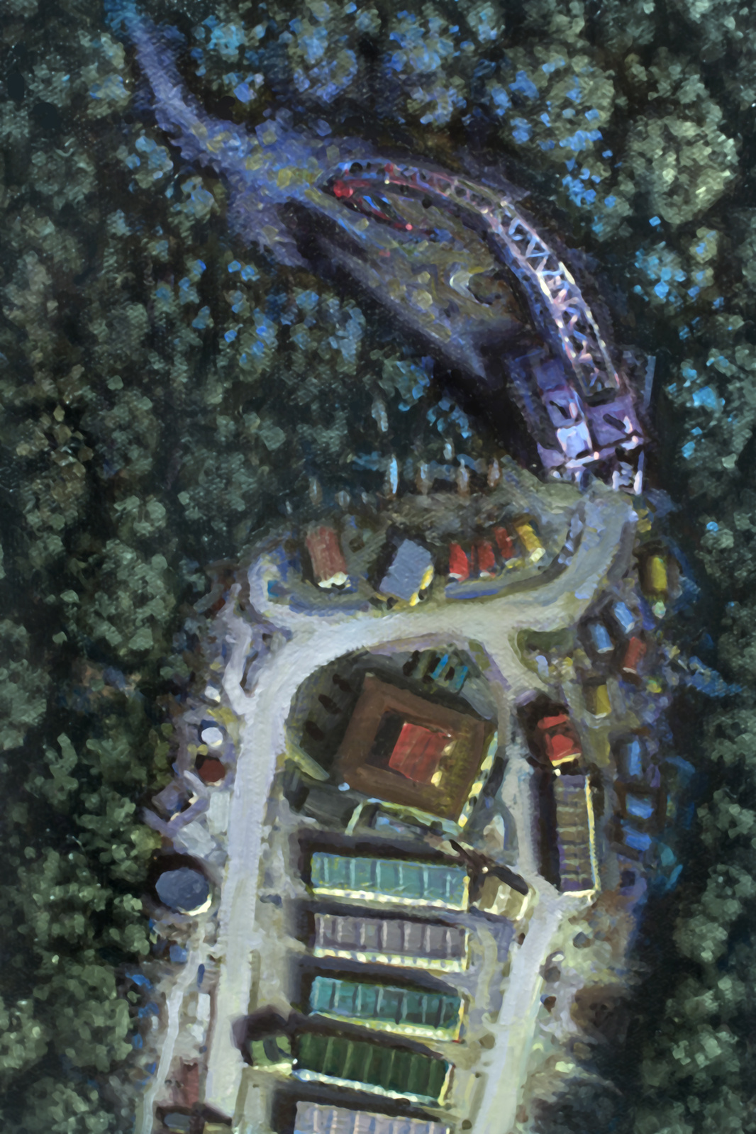 Aerial view of a tractor trailer lot penetrating a forest
