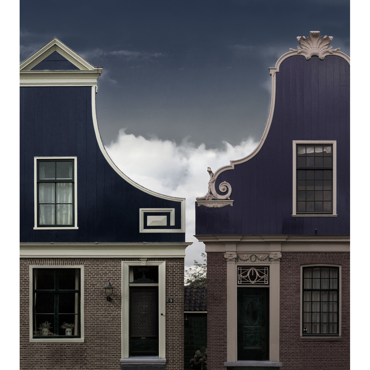 Graduated sky and cloud seen between adjacent Baroque gables, near Amsterdam