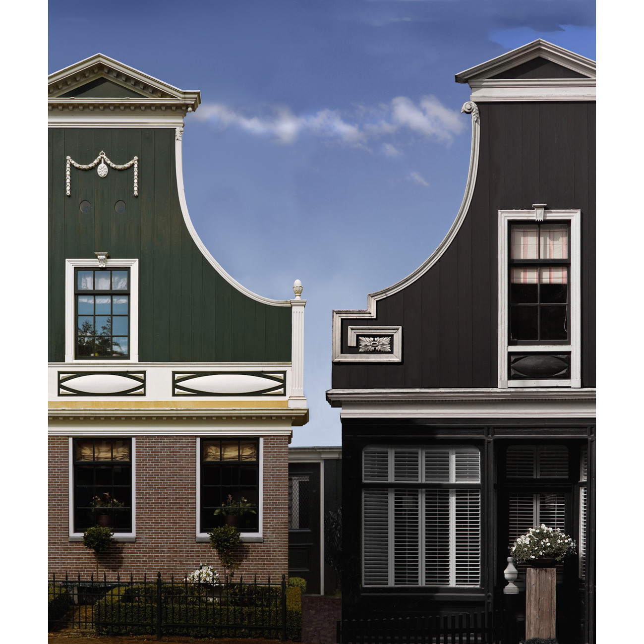 Graduated sky and cloud seen between adjacent Baroque gables, near Amsterdam