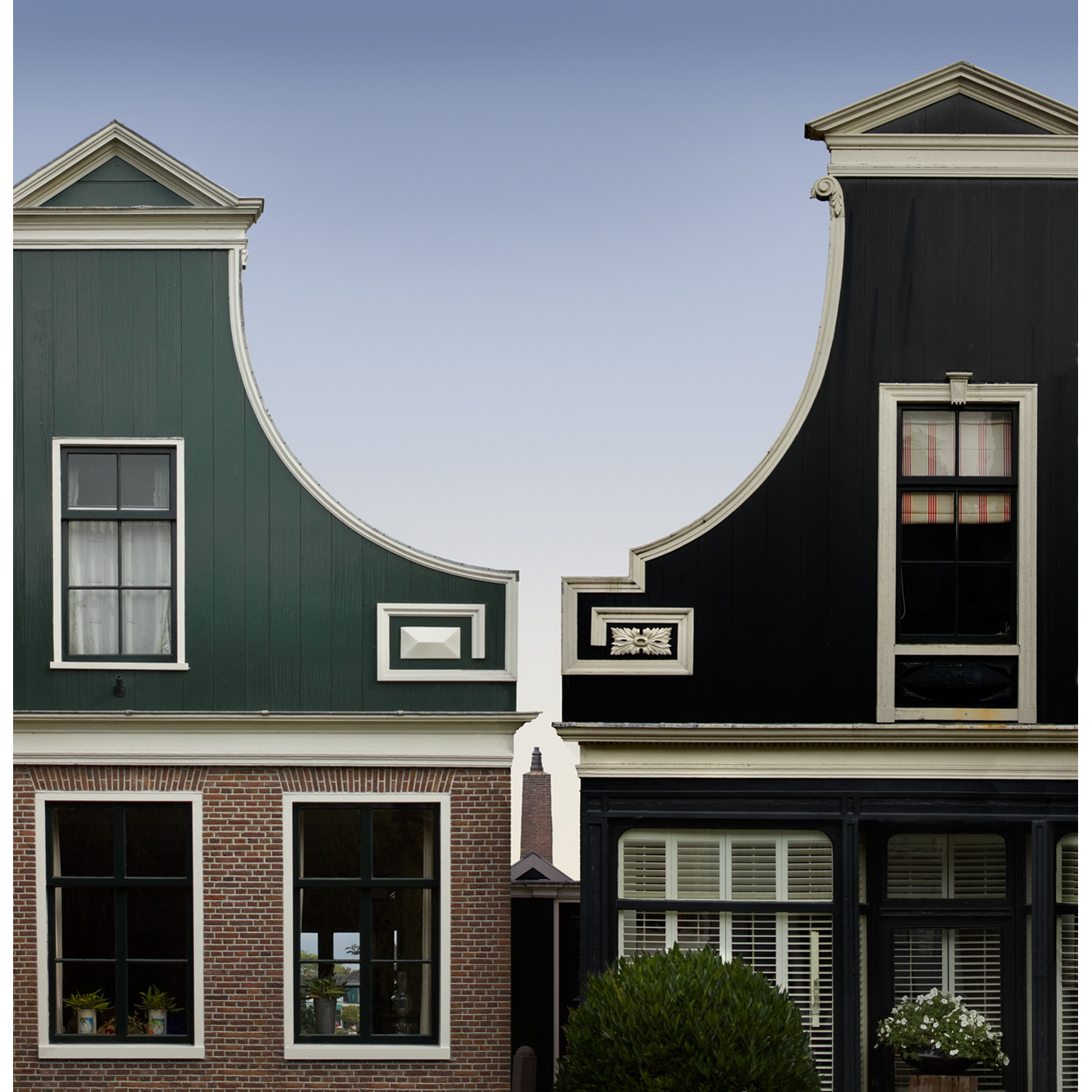Graduated sky seen between adjacent Baroque gables, near Amsterdam
