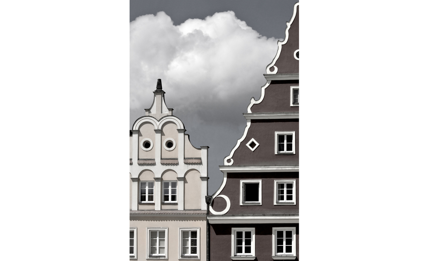 Graduated sky seen between adjacent Baroque gables, Wroclaw, Poland. Reduced color.