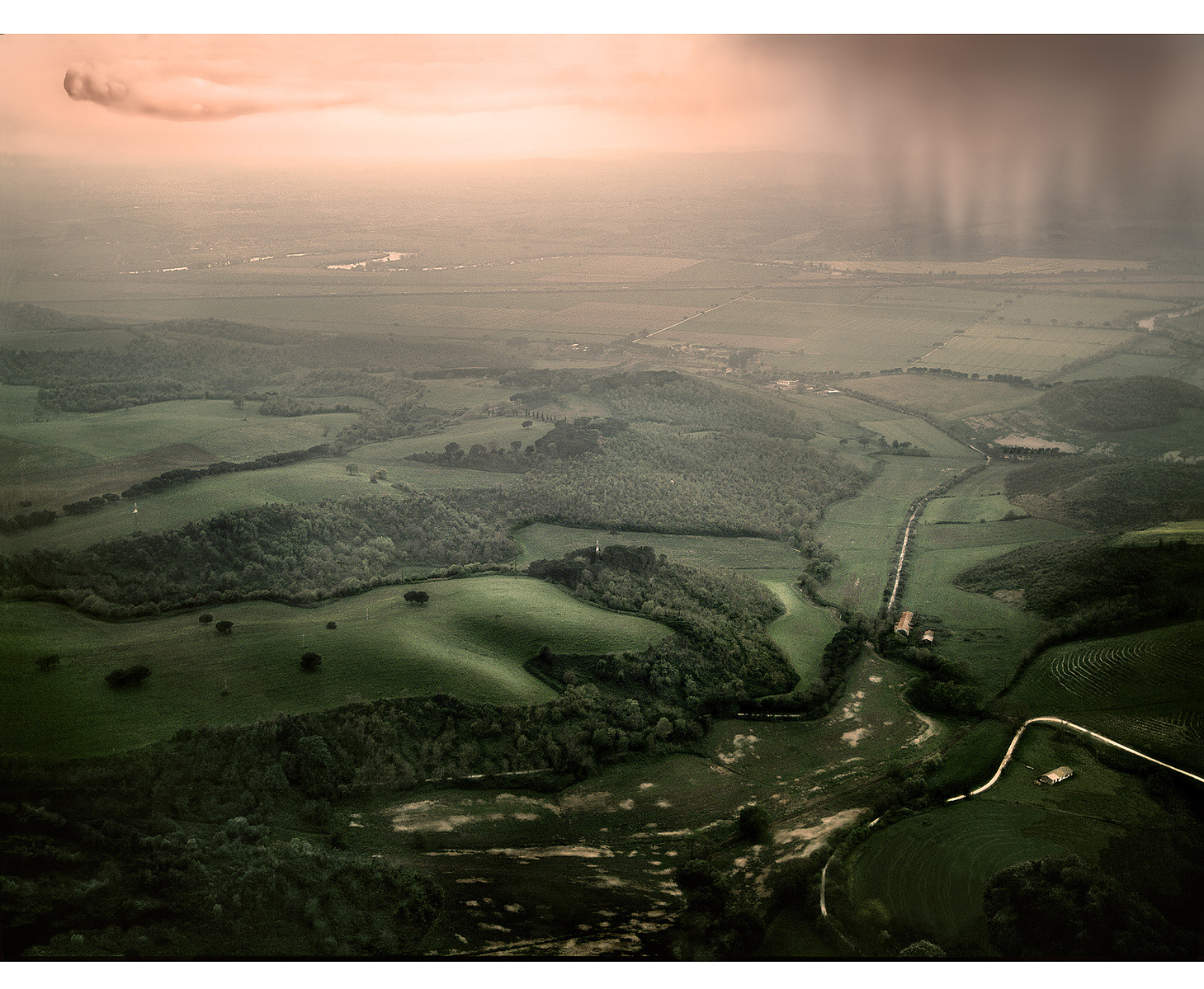 Roman countryside: Rolling hills with oncoming storm cloud.