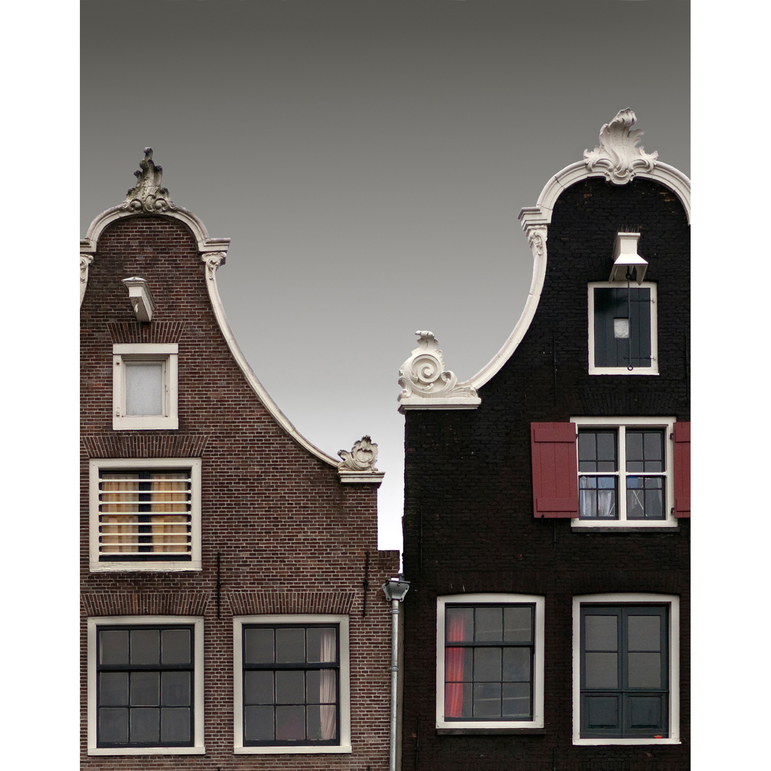 Graduated sky seen between adjacent Baroque gables, Amsterdam