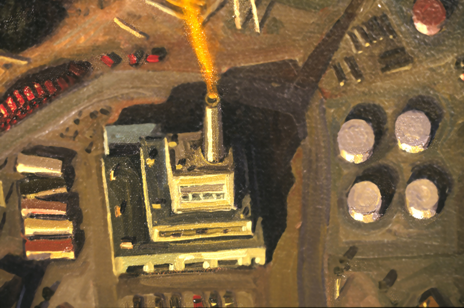 Aerial view of a factory spewing orange smoke