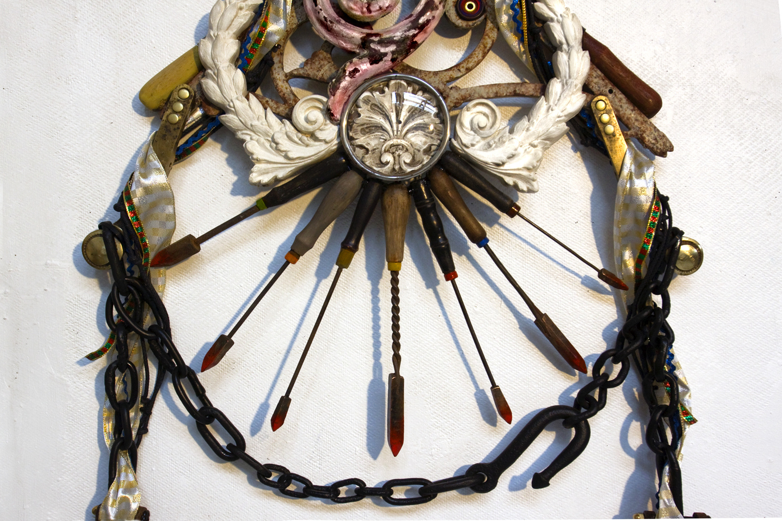 Wall assemblage referencing diverse religious iconography, devotion and penance. Detail