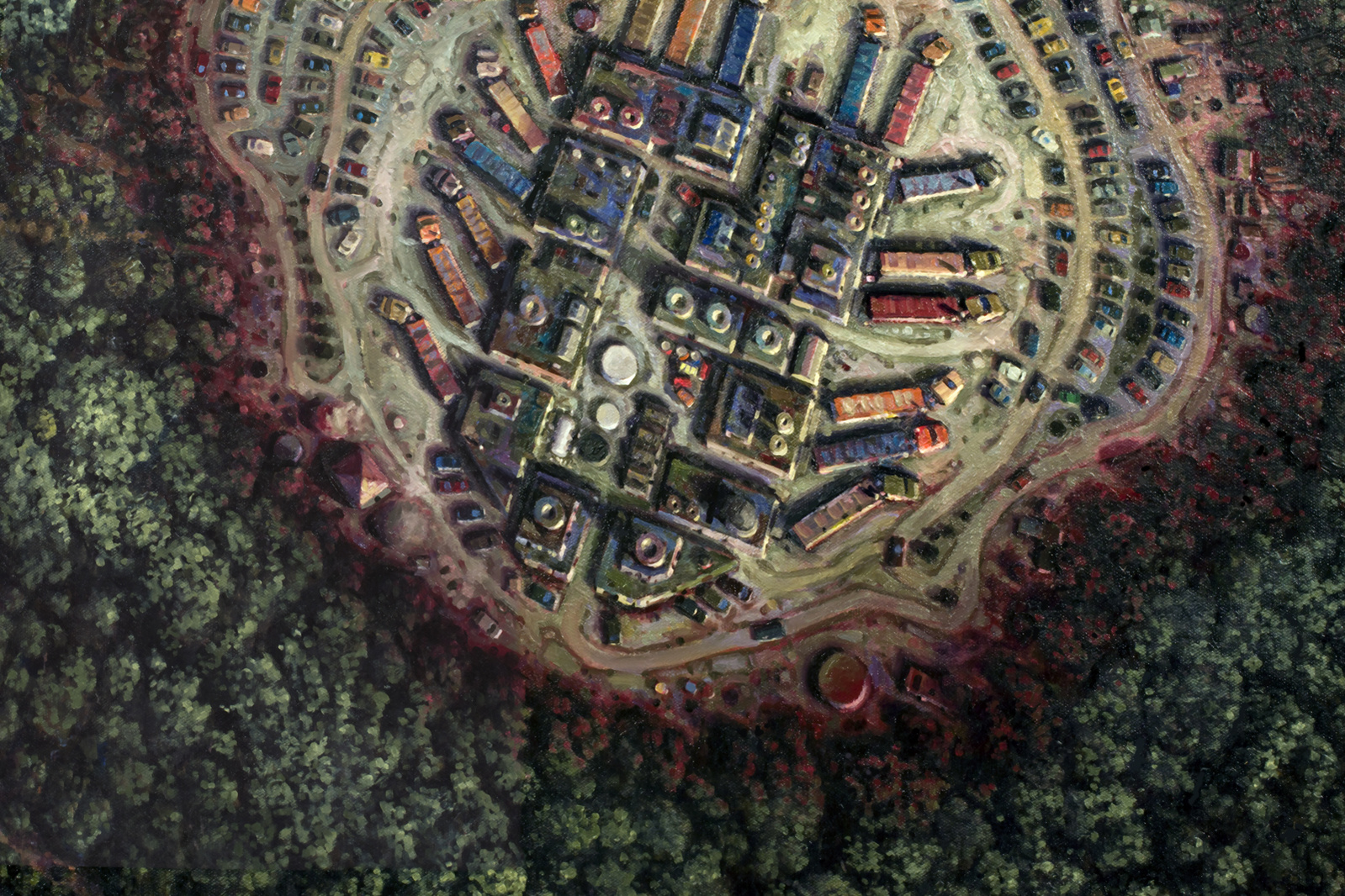 Aerial view of an industrial park advancing on a woodland