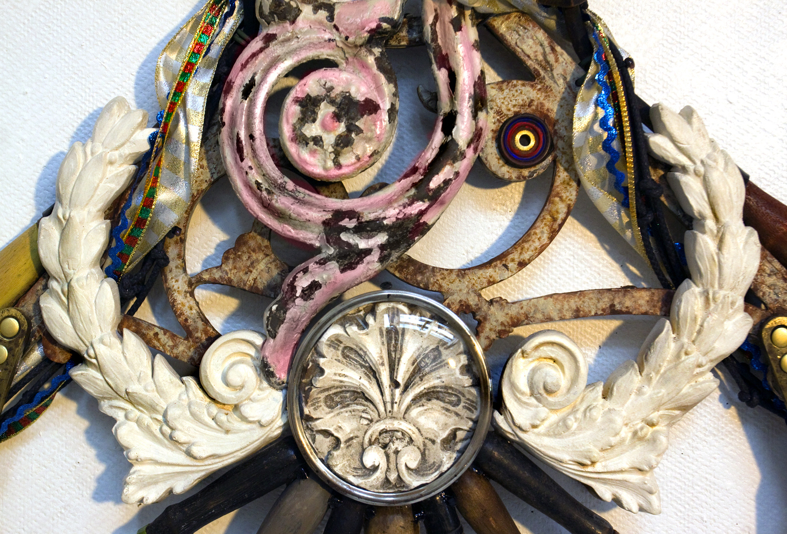 Wall assemblage referencing diverse religious iconography, devotion and penance. Detail