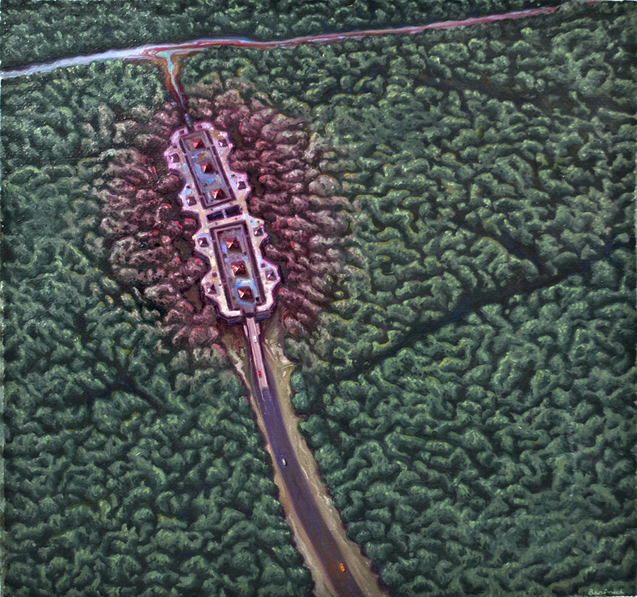 Aerial view of a factory and access road moving towards a stream or river.