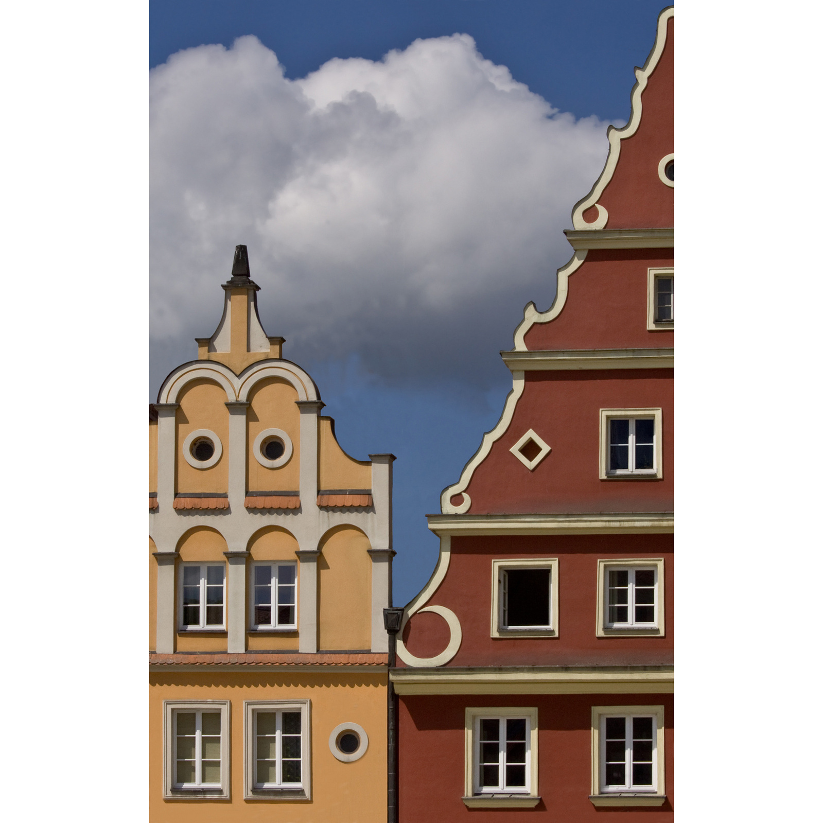 Large cloud seen between adjacent Baroque gables, Wroclaw, Poland