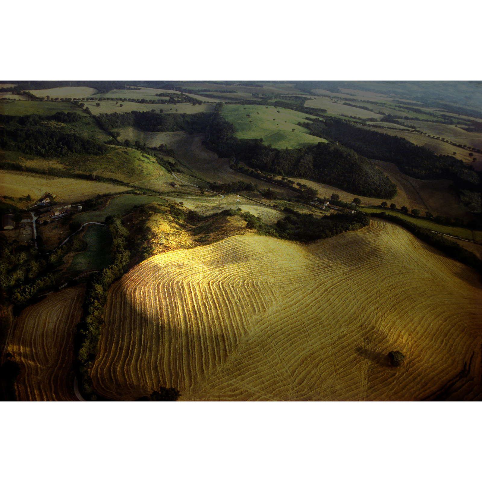 Roman countryside: Rolling, cultivated hills, sunspot.
