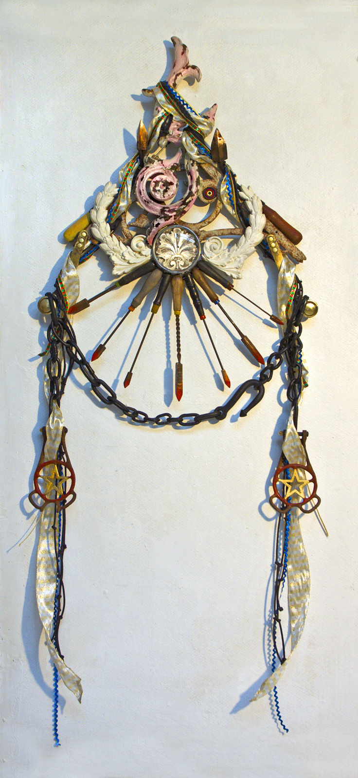 Wall assemblage referencing diverse religious iconography, devotion and penance.