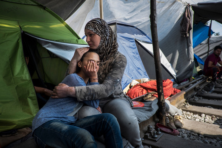 Leen Issa comforts her daughter, 11 year-old Rezan, who was suffering from the effects of tear gas exposure from clashes the previous night. Rezan had open heart surgery as a baby and still suffers from a heart condition. The family from Syria lives in te