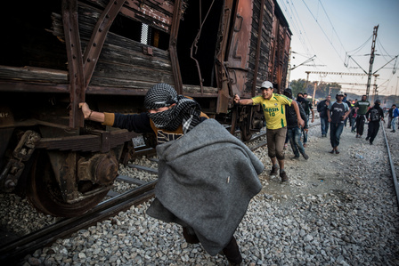 Protesting immigrants pushed an abandoned train wagon towards the border during a protest on May 18, 2016, at Idomeni camp. Clashes ensued between Greek police, who fired tear gas and stun grenades, and immigrants.