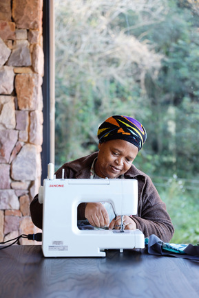 Woman working on sewing machine
