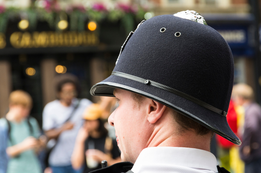 A Metropolitan Police Office waring his distinctive helmet!