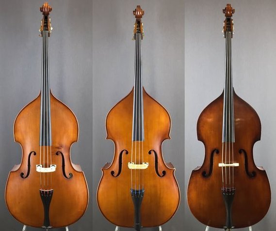 three 1/2 size double basses