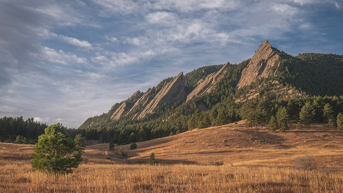 Golden hour light on the boulder flatirons on an autumn morning
