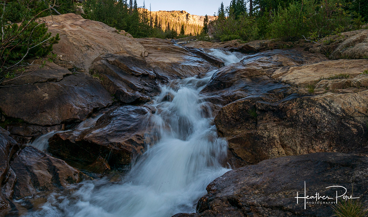 A long exposure landscape photo of the Roaring River in Rocky Mountain National Park.