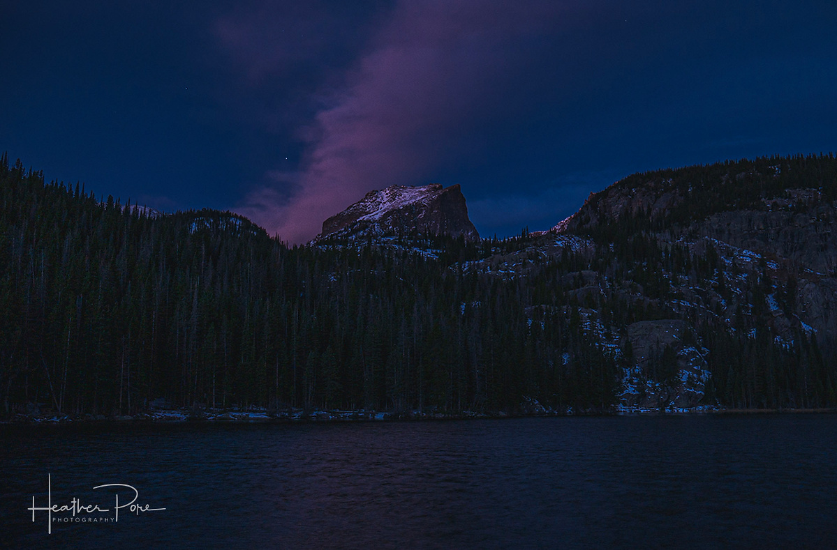 Blue hour landscape photograph of hallett peak from bear lake in rocky mountain national park