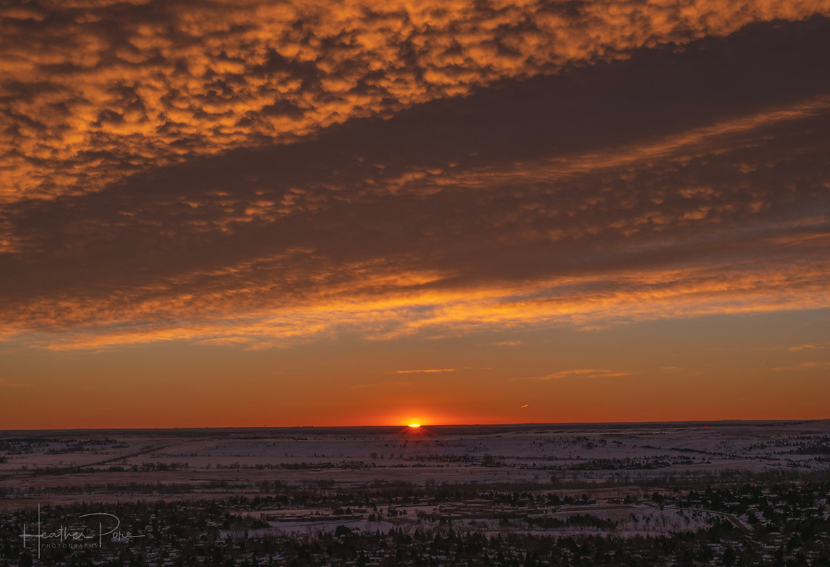 sunrise photography as the sun just starts to peak over the horizon, taken from NCAR