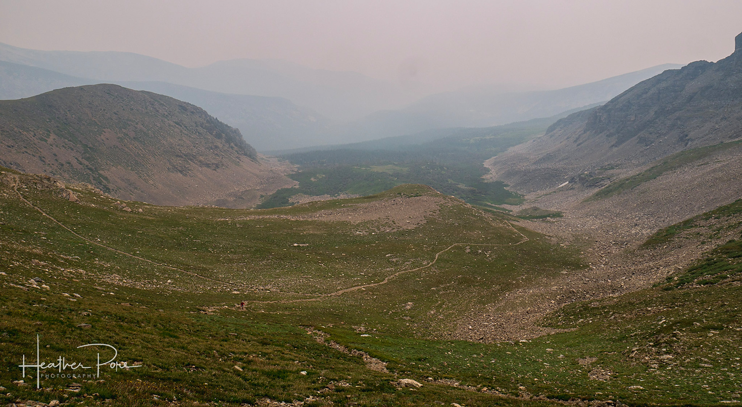Looking down at the Buchanan Pass Trail from Buchanan Pass covered in wildfire smoke haze