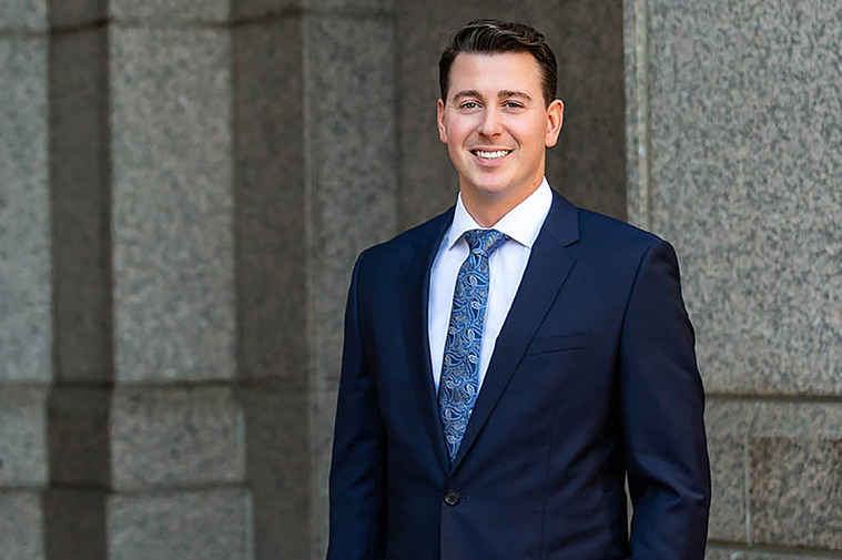 Lawyer in blue suit getting is photo taken for corporate headshots Atlanta.