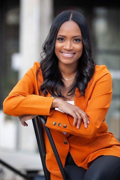 Lady in orange jacket. Likedin Headshots Atlanta.
