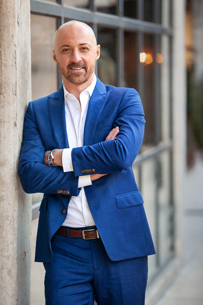 Young man getting photo taken by dating headshots in Atlanta.