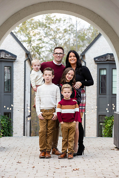 A family getting photographed in Atlanta by photographers David and Jess.