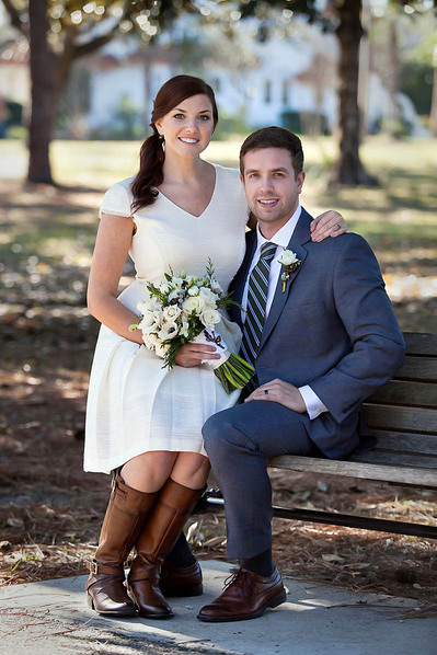 Couple on a bench posing for their Atlanta wedding photographer.