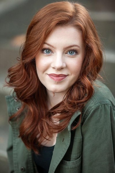 Lady posing for dating headshot.
