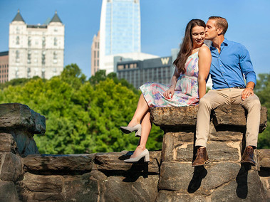 Couple posing in Piedmont Park for Photographer.