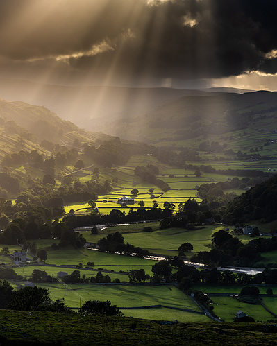The sun's rays lighting up Swaledale valley