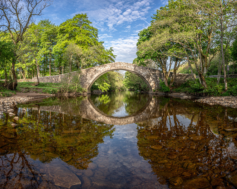 Photograph of a large pack horse bridge over the river Swale taken in early summer