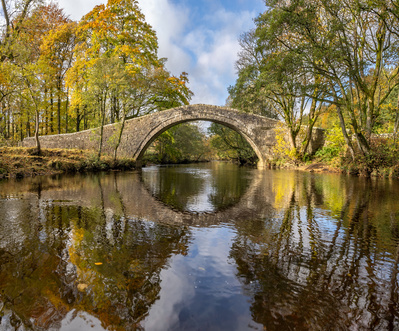 A pack horse bridge across the river Swale in Swaledale, Yorkshire Dales