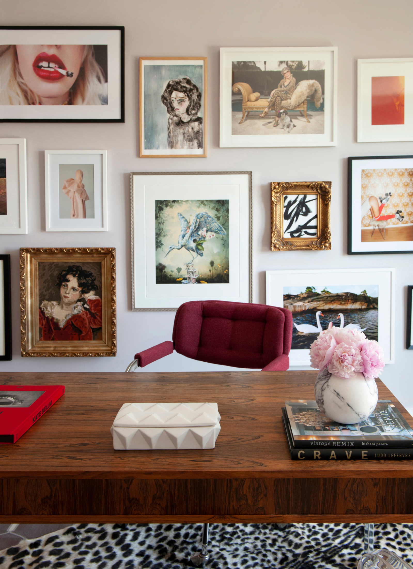 Contemporary home office featuring eclectic gallery wall and large wooden desk