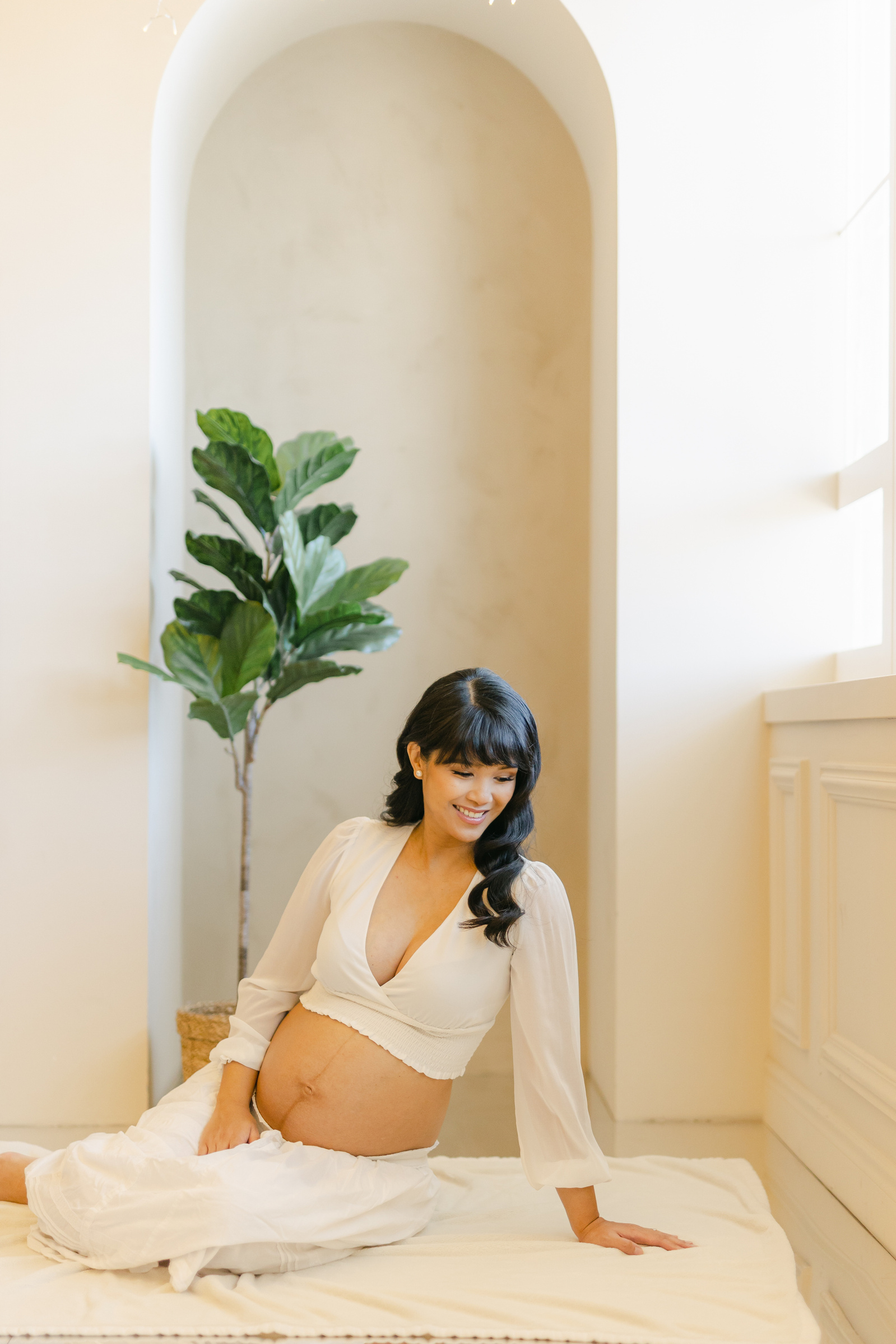 Pregnant woman sitting on the floor