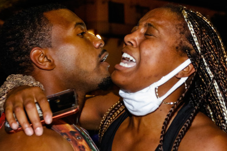 A man embraces his girlfriend on June 1 after the LAPD beat her with a baton Monday, June 1, 2020.
