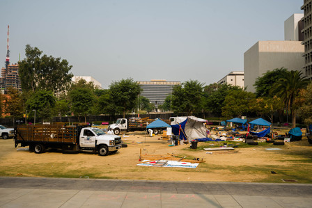 City workers clear out Black Unity's encampment on Grand Park in Los Angeles, Sunday, Sept. 13, 2020. Various groups, including Black Unity, had continuously occupied the grassy area in front of the Los Angeles City Hall for almost three months.