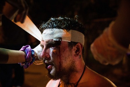 Alex Brown, a protester affiliated with the racial injustice activism group Black Unity, is treated by street medics after the Los Angeles County sheriff’s deputies shot him with a “less lethal” munition, Monday, Sept. 7, 2020.