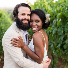 Bride and groom embrace one another in a winery in Dundee Oregon
