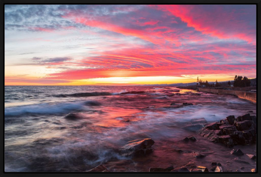 Vibrant pink clouds at sunset over the Sawtooth Mountains and Lake Superior in Grand Marais, Minnesota