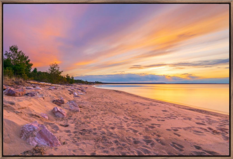 Vibrant color clouds at sunset over Lake Superior and Au Train Beach in the Upper Peninsula of Michigan 