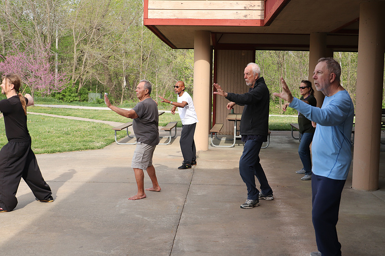 A group practices Tai Chi poses on April 20, 2023, at Twin Lakes Recreation Area in Columbia. The class meets every Thursday to practice 108 yang style from 8:30 a.m. to 9:30 a.m.