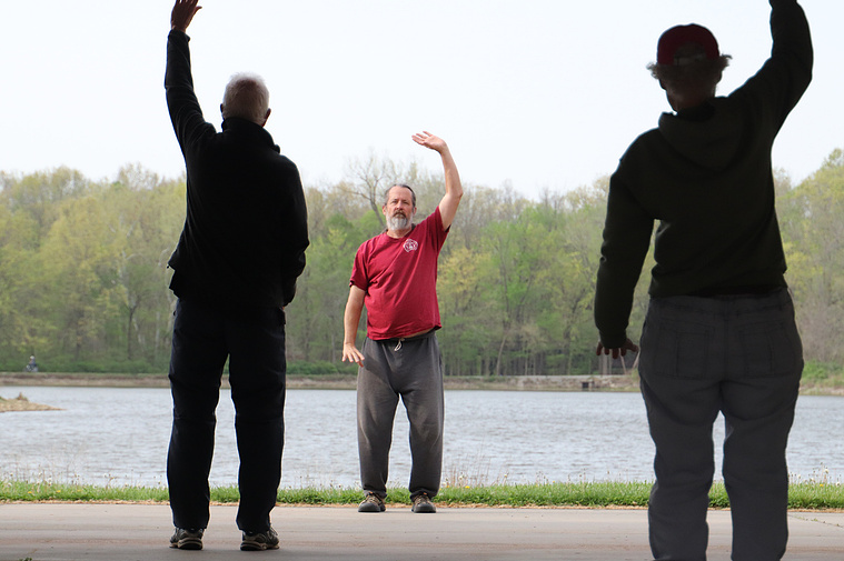 Dan Miller leads stretching exercises with his Tai Chi class on April 20, 2023, at Twin Lakes Recreation Area in Columbia. Miller has been practicing Tai Chi for 40 years and teaching for 19.
