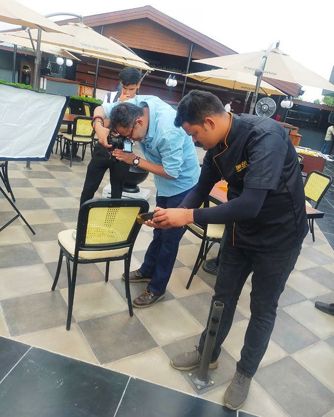 Food photographer Parikshit Rao working on assignment in a behind the scenes photo